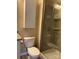 Bathroom features a shower with sliding glass door, large mirror and vanity, and tiled floor at 10817 Bere Island Dr, Charlotte, NC 28278