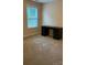 Bedroom with neutral walls, carpet, and a large window offering ample natural light at 10817 Bere Island Dr, Charlotte, NC 28278