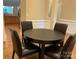 Cozy dining area with a round table and chairs, adjacent to the kitchen, great for Gathering meals at 10817 Bere Island Dr, Charlotte, NC 28278