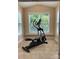 Bright and airy exercise room with tiled floors, large windows, and fitness equipment at 10817 Bere Island Dr, Charlotte, NC 28278