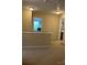 Upstairs hallway with neutral carpet and access to bedrooms at 10817 Bere Island Dr, Charlotte, NC 28278