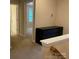 Upstairs hallway with neutral carpet, closet, and access to bedrooms at 10817 Bere Island Dr, Charlotte, NC 28278