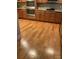 Gourmet kitchen features hardwood flooring, double ovens, and warm wood cabinetry at 10817 Bere Island Dr, Charlotte, NC 28278