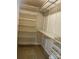 Well-organized walk-in closet with adjustable shelving and ample storage space at 10817 Bere Island Dr, Charlotte, NC 28278