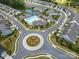 Community aerial view highlighting roundabout, pool, and ponds within the neighborhood at 1108 Stella Ct, Monroe, NC 28110