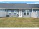 Backyard featuring a well-maintained lawn and a neutral colored home with white trim at 1108 Stella Ct, Monroe, NC 28110