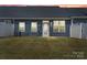 Backyard featuring a well-maintained lawn and a neutral colored home with white trim at 1108 Stella Ct, Monroe, NC 28110