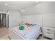 Bright bedroom featuring neutral paint, a colorful comforter, and a side table at 1108 Stella Ct, Monroe, NC 28110