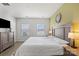 Well-lit bedroom featuring a dresser, plush carpet, and windows with horizontal blinds at 1108 Stella Ct, Monroe, NC 28110