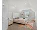 Bright bedroom with a full-sized bed and a nightstand at 1108 Stella Ct, Monroe, NC 28110