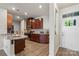The updated kitchen has stainless steel appliances and granite countertops at 1108 Stella Ct, Monroe, NC 28110