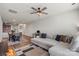 Spacious living room with large sectional sofa, ceiling fan, and hardwood flooring at 1108 Stella Ct, Monroe, NC 28110