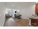 Open living space with kitchen, dining, and living area filled with natural light at 1108 Stella Ct, Monroe, NC 28110