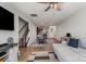Open-concept living room with hardwood floors, modern lighting, and staircase access at 1108 Stella Ct, Monroe, NC 28110