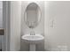 Cozy powder room with modern fixtures, clean neutral walls, and ample lighting at 1108 Stella Ct, Monroe, NC 28110