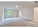Bright and airy bedroom with a neutral color scheme and plush carpeting at 126 Dorian Pl, Troutman, NC 28166