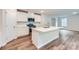 Bright kitchen featuring a large island, modern appliances, white subway tile backsplash, and ample cabinet space at 126 Dorian Pl, Troutman, NC 28166