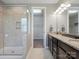 Bathroom featuring a large tiled shower, dual sinks, and granite countertops at 1305 Kings Grove Dr, York, SC 29745
