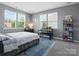 Spacious bedroom with three windows, desk area, offering lots of natural light, comfort, and productivity at 1305 Kings Grove Dr, York, SC 29745