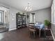 Light-filled dining room with hardwood floors, neutral paint, and a view through the house at 1305 Kings Grove Dr, York, SC 29745