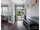 Inviting foyer with hardwood floors, half wall, and elegant french doors to the left at 1305 Kings Grove Dr, York, SC 29745