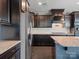 Sleek kitchen with black cabinets, stainless steel appliances, and granite countertops at 1305 Kings Grove Dr, York, SC 29745
