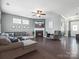 Inviting living room with hardwood floors, a cozy fireplace, and a sectional sofa at 1305 Kings Grove Dr, York, SC 29745