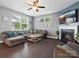 Inviting living room with hardwood floors, a cozy fireplace, and a sectional sofa at 1305 Kings Grove Dr, York, SC 29745