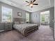 Spacious main bedroom featuring tray ceilings, a ceiling fan, and gray walls at 1305 Kings Grove Dr, York, SC 29745