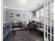 Comfortable home office with gray walls, hardwood floors, large desk, and ample light at 1305 Kings Grove Dr, York, SC 29745