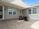 Covered patio area featuring a stylish table and seating, offering an ideal space for outdoor dining and relaxation at 1305 Kings Grove Dr, York, SC 29745