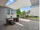 Serene covered patio with outdoor seating and view of fenced yard, perfect for relaxation and enjoying the outdoors at 1305 Kings Grove Dr, York, SC 29745