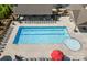 Community pool area offering residents a spacious pool with ample lounging chairs at 1305 Kings Grove Dr, York, SC 29745