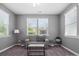 Sitting room featuring multiple windows offering natural light and a comfortable sofa at 1305 Kings Grove Dr, York, SC 29745