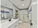 Bright bathroom featuring a glass shower, floating shelves, and sleek, modern fixtures at 1320 Fillmore Ave # 137, Charlotte, NC 28203