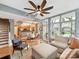 Open-concept living area with hardwood floors, a modern fan, and lots of natural light at 1320 Fillmore Ave # 137, Charlotte, NC 28203