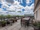 Spacious rooftop patio with outdoor dining furniture and stunning views at 1320 Fillmore Ave # 137, Charlotte, NC 28203