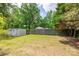 Spacious backyard with a storage shed and a wooden fence at 1415 Midlake Rd, Kannapolis, NC 28083