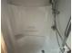 Clean white shower stall with built-in shelves and shower head at 1415 Midlake Rd, Kannapolis, NC 28083