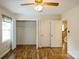Bedroom featuring wood floors, closet, and neutral color scheme at 16612 Grapperhall Dr, Huntersville, NC 28078