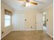 Neutral bedroom with carpet, ceiling fan, and closet with folding doors at 16612 Grapperhall Dr, Huntersville, NC 28078