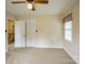 Bedroom with carpet, ceiling fan, closet, and window at 16612 Grapperhall Dr, Huntersville, NC 28078
