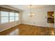 Bright dining room with hardwood floors, chandelier, and access to the kitchen, ideal for gatherings at 16612 Grapperhall Dr, Huntersville, NC 28078