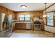 Traditional kitchen with stainless steel appliances, wooden cabinets, and granite countertops at 16612 Grapperhall Dr, Huntersville, NC 28078