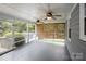 Relaxing screened porch with ceiling fans and view of backyard at 16612 Grapperhall Dr, Huntersville, NC 28078
