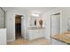 Bathroom vanity with granite countertop, double sinks, and ample storage at 16831 Alydar Commons Ln, Charlotte, NC 28278