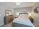 Bedroom featuring wood furnishings, soft neutral colors, and ample natural light at 16831 Alydar Commons Ln, Charlotte, NC 28278