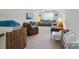 Spacious bonus room with comfortable seating, a TV, and plenty of play space for children at 16831 Alydar Commons Ln, Charlotte, NC 28278