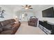 Spacious bonus room with plush seating, a TV, and carpeted floors for comfort at 16831 Alydar Commons Ln, Charlotte, NC 28278