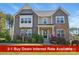 Charming two-story home featuring a stone and siding facade, manicured landscaping, and an inviting front porch at 16831 Alydar Commons Ln, Charlotte, NC 28278